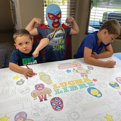The Lucha Libre giant coloring sheet being colored in with markers at a table
