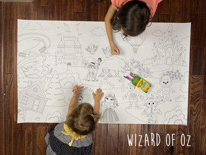 Child coloring the Wizard of OZ giant coloring sheet on a wood floor with crayons