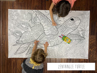 Thumbnail for Child coloring the Zentangle Turtle giant coloring sheet on a wood floor with crayons