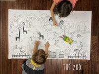 Thumbnail for Child coloring the Zoo giant coloring sheet on a wood floor with crayons
